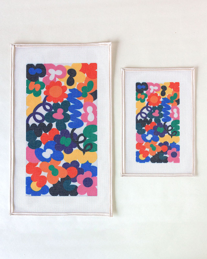 Needlepoint canvases with illustration of colorful flowers