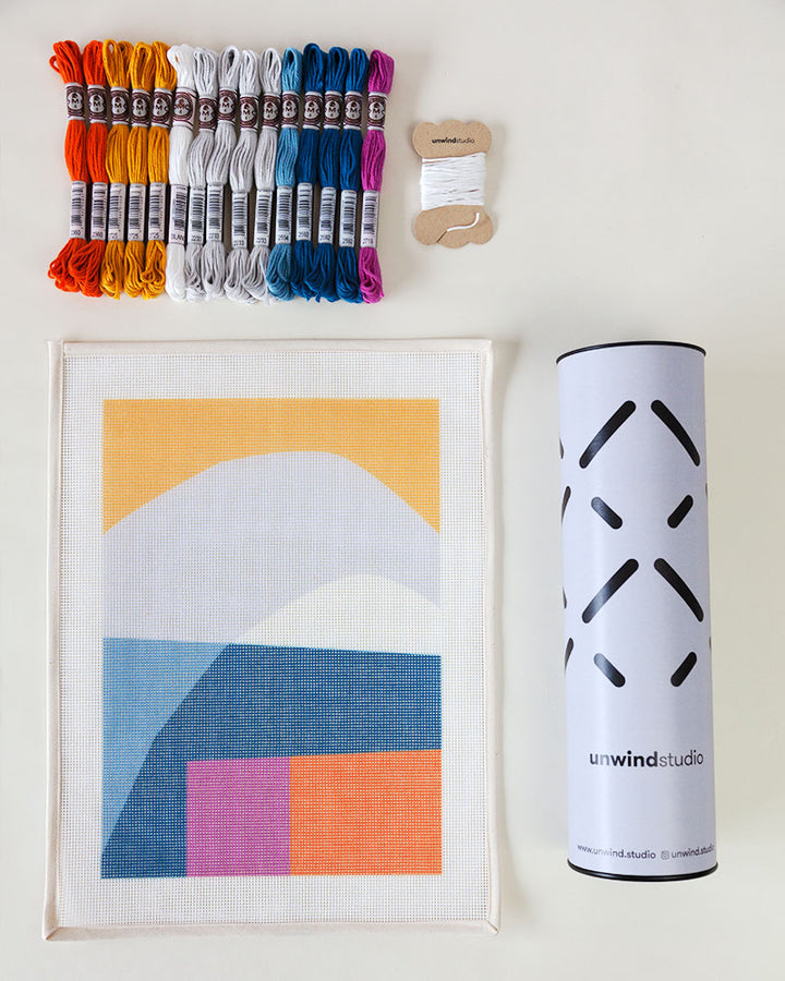 Needlepoint kit with abstract illustration, with threads and packaging