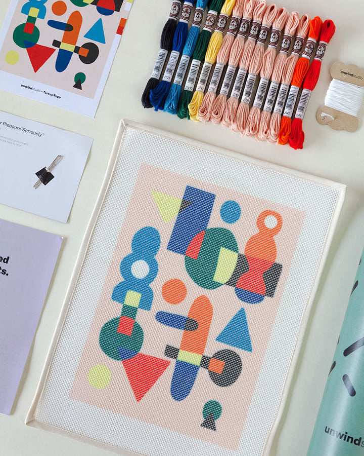 needlepoint kit with abstract illustration, with threads and packaging