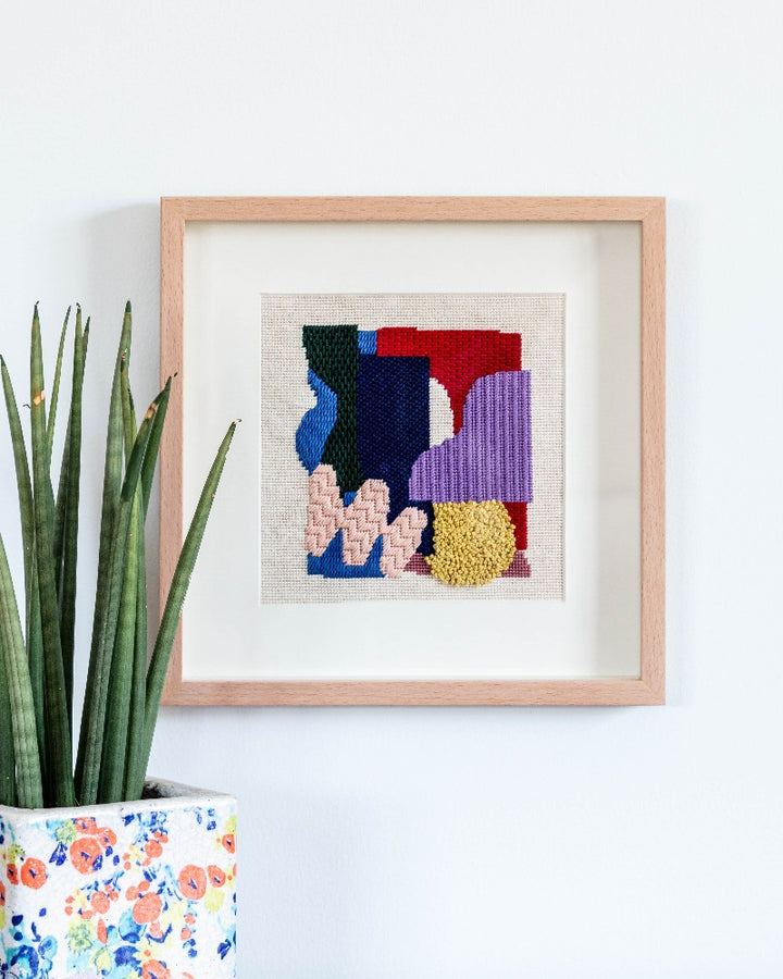 Needlepoint canvas with illustration of abstract shapes and colors